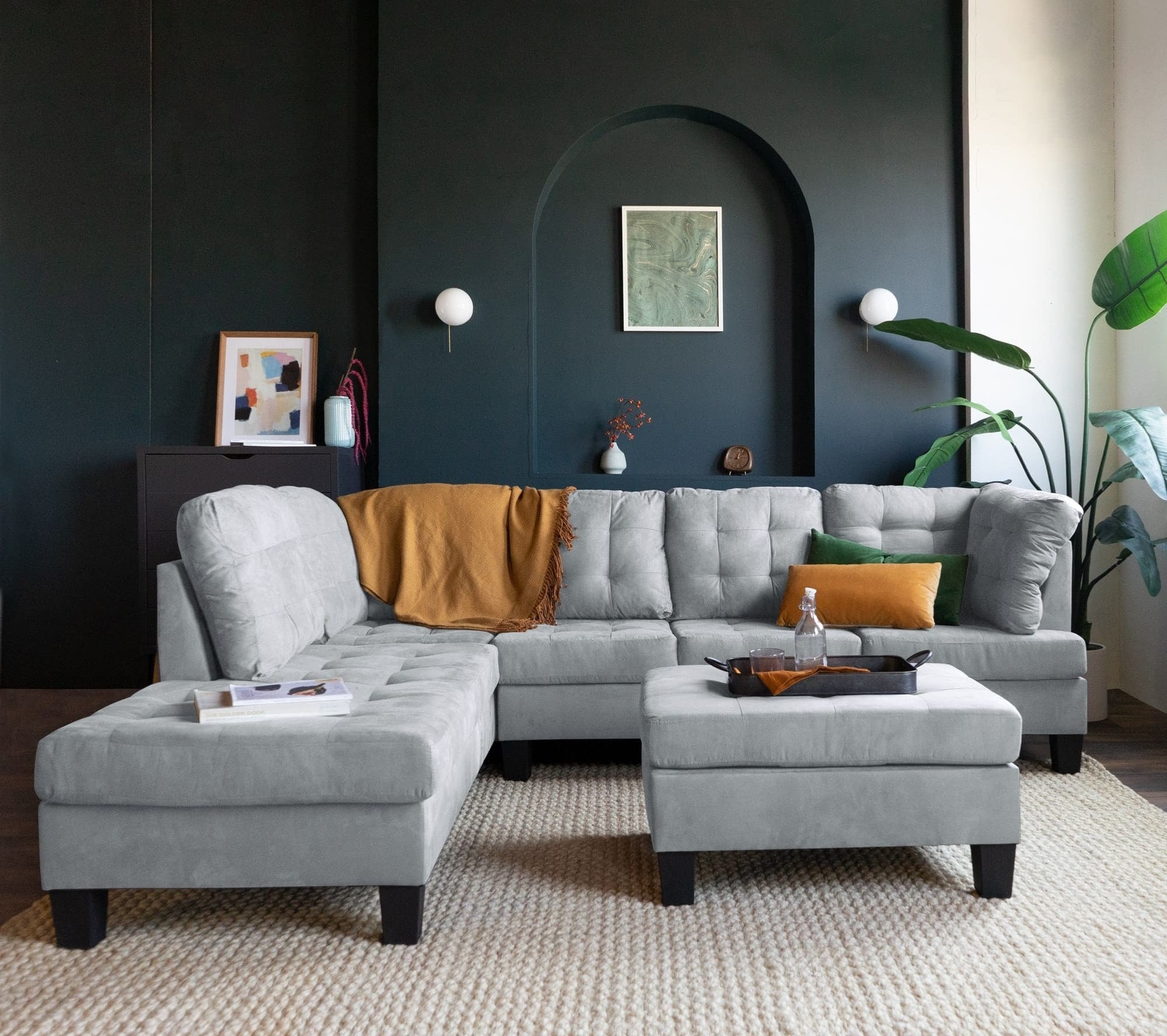 Light gray three-piece sectional set in a living room