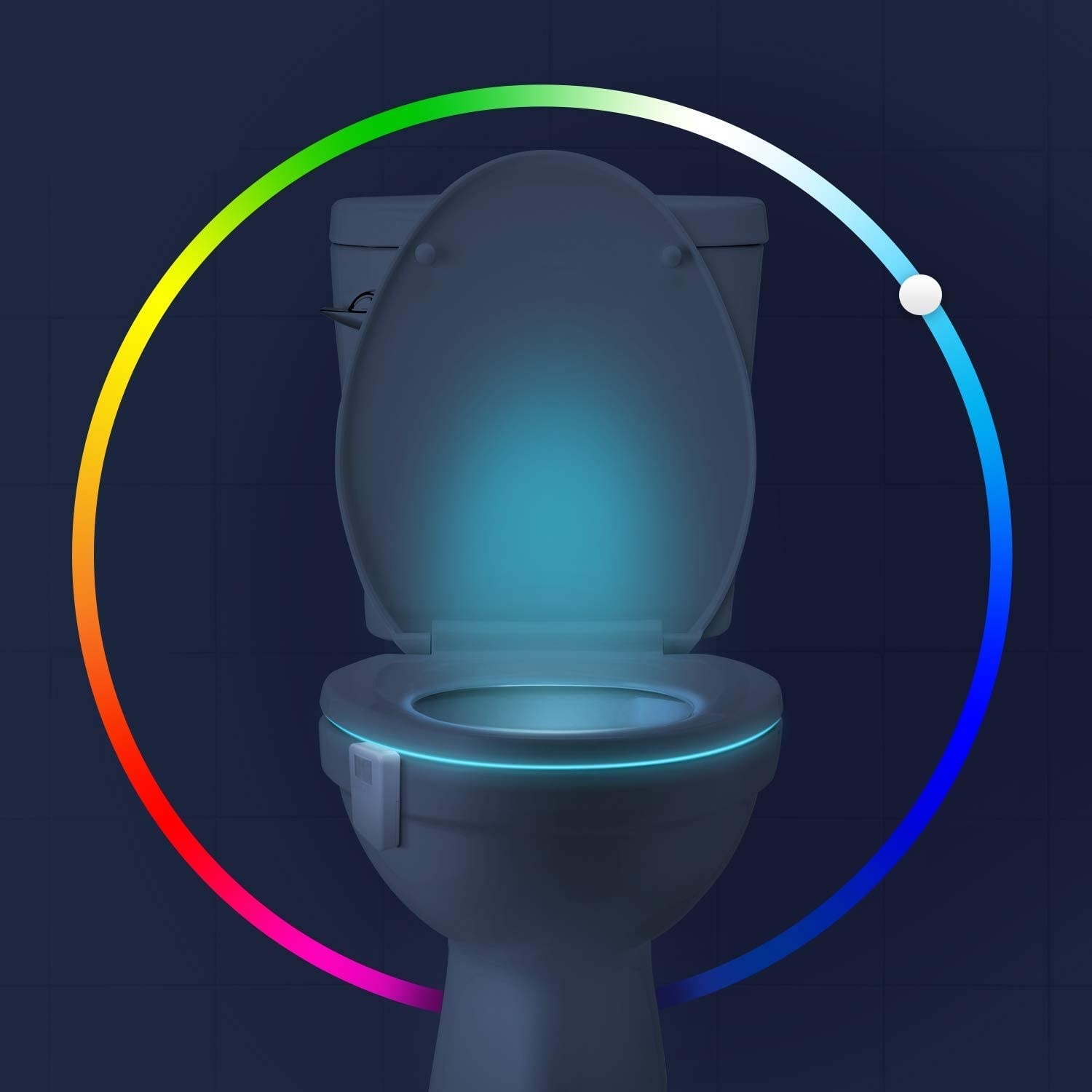 A toilet in the dark with the lamp illuminating the inside with a soft glow, a colour wheel is around the ouside