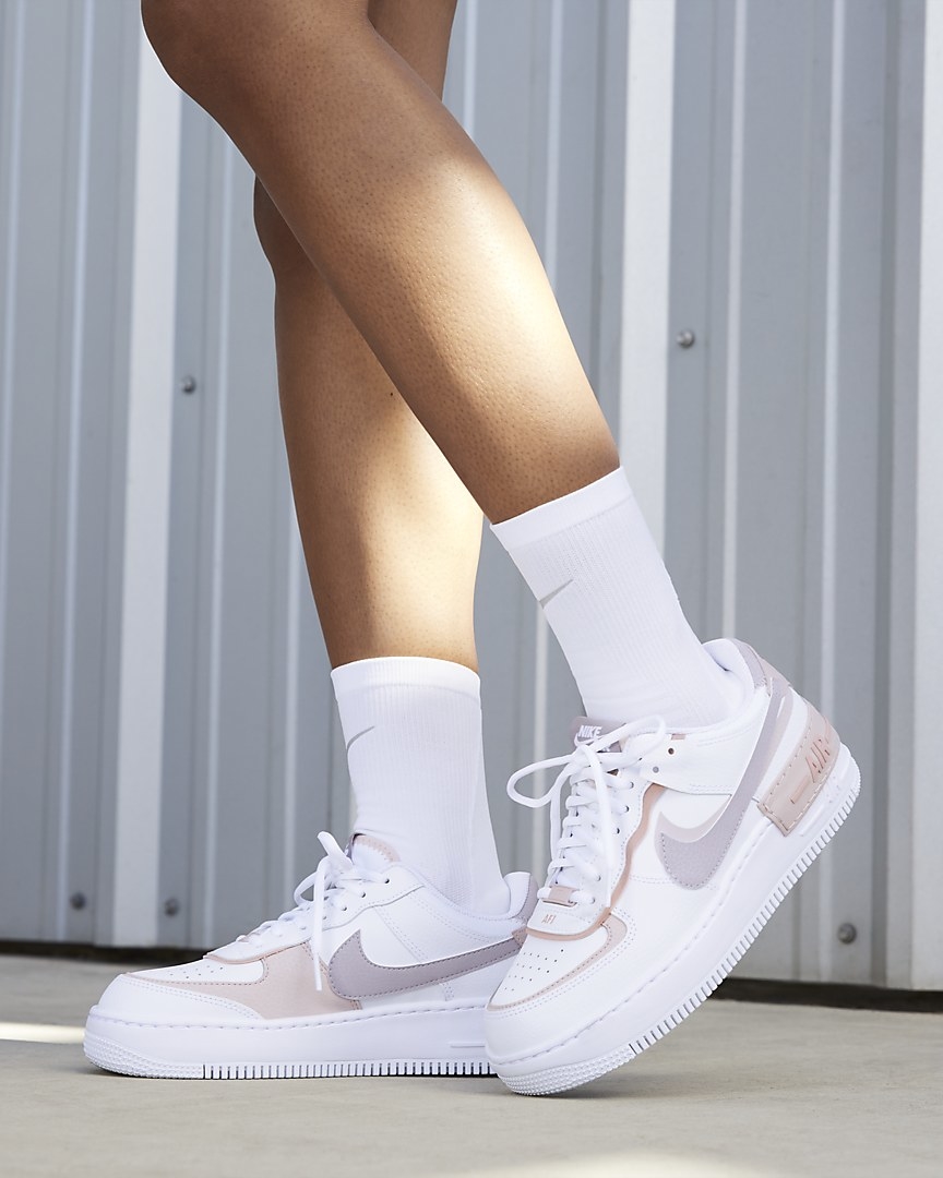 Model wearing sneakers with white socks