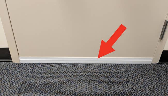a reviewer image of a door stopper mounted on the bottom of the door
