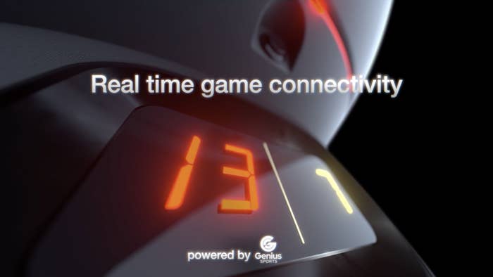 A closeup of the Super Bowl Punch Bowl's score board with copy that reads, "Real time game connectivity"