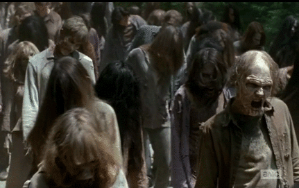 zombies walking on a road in Walking Dead