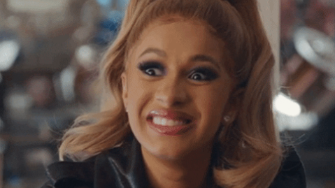Cardi B from Hustlers with wide eyes and raised eyebrows
