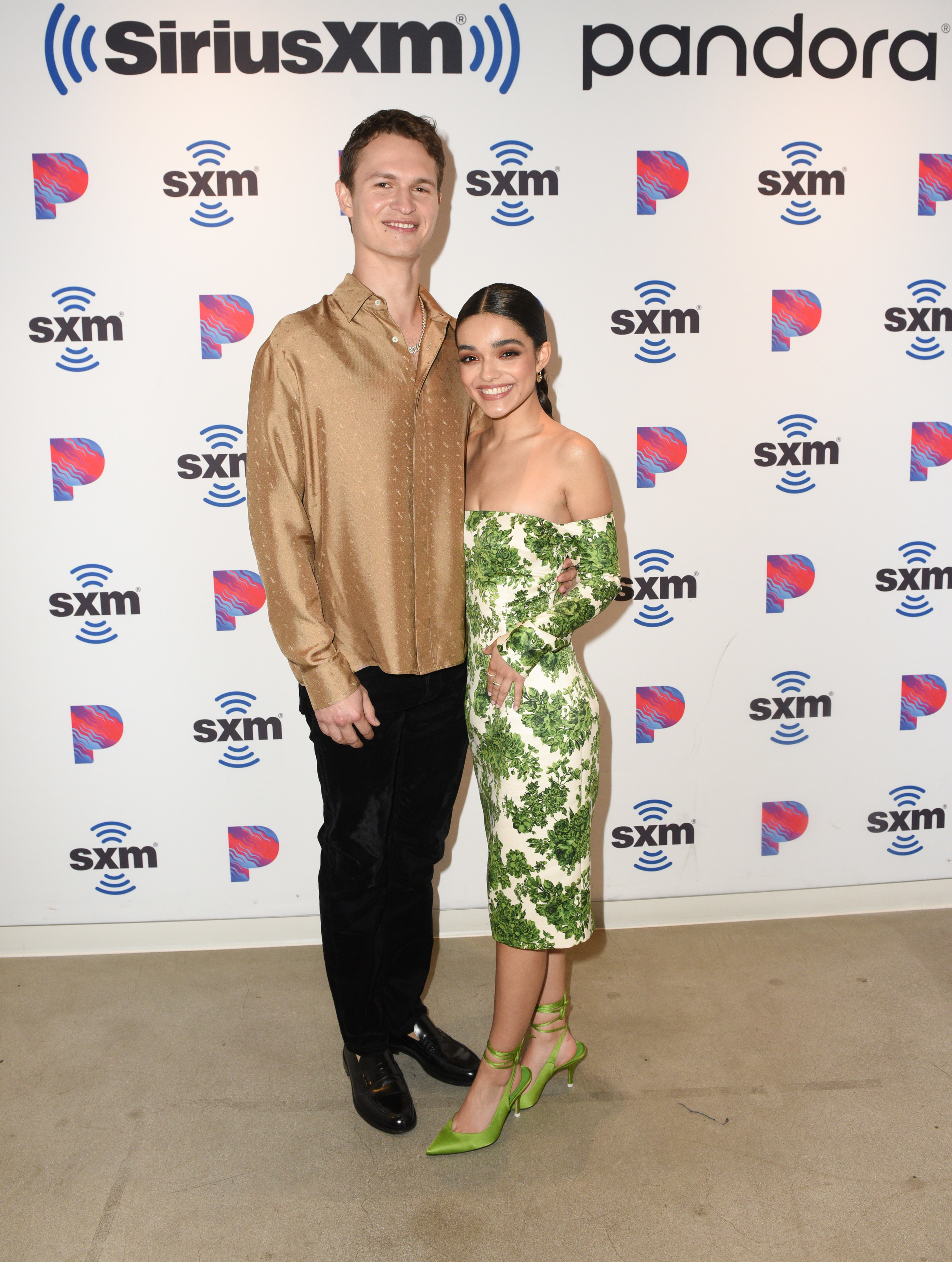 Ansel and Rachel posing together for photographers at an event