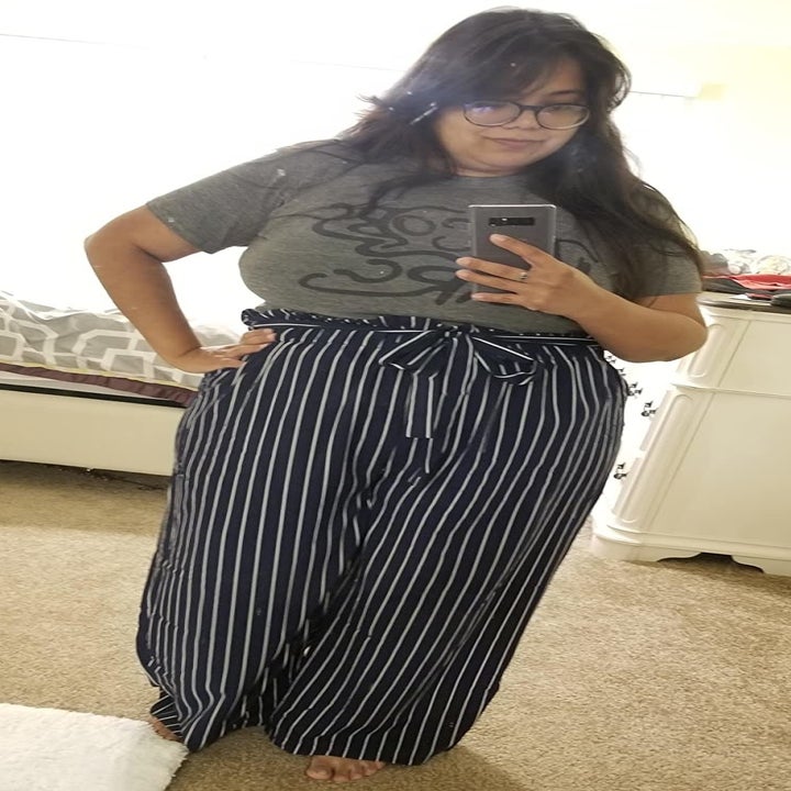 reviewer wearing the navy and white striped style