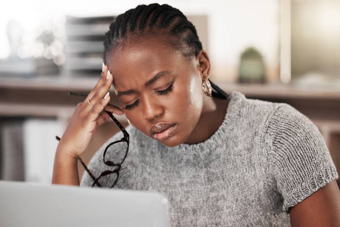 Woman having a headache at her desk