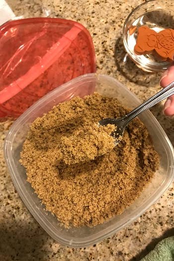 a reviewer's same container now filled with soft brown sugar
