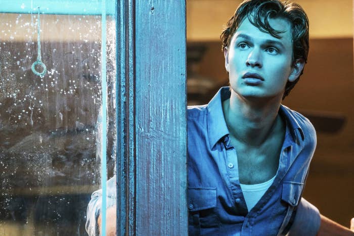 Ansel looking out of a window in a scene from West Side Story
