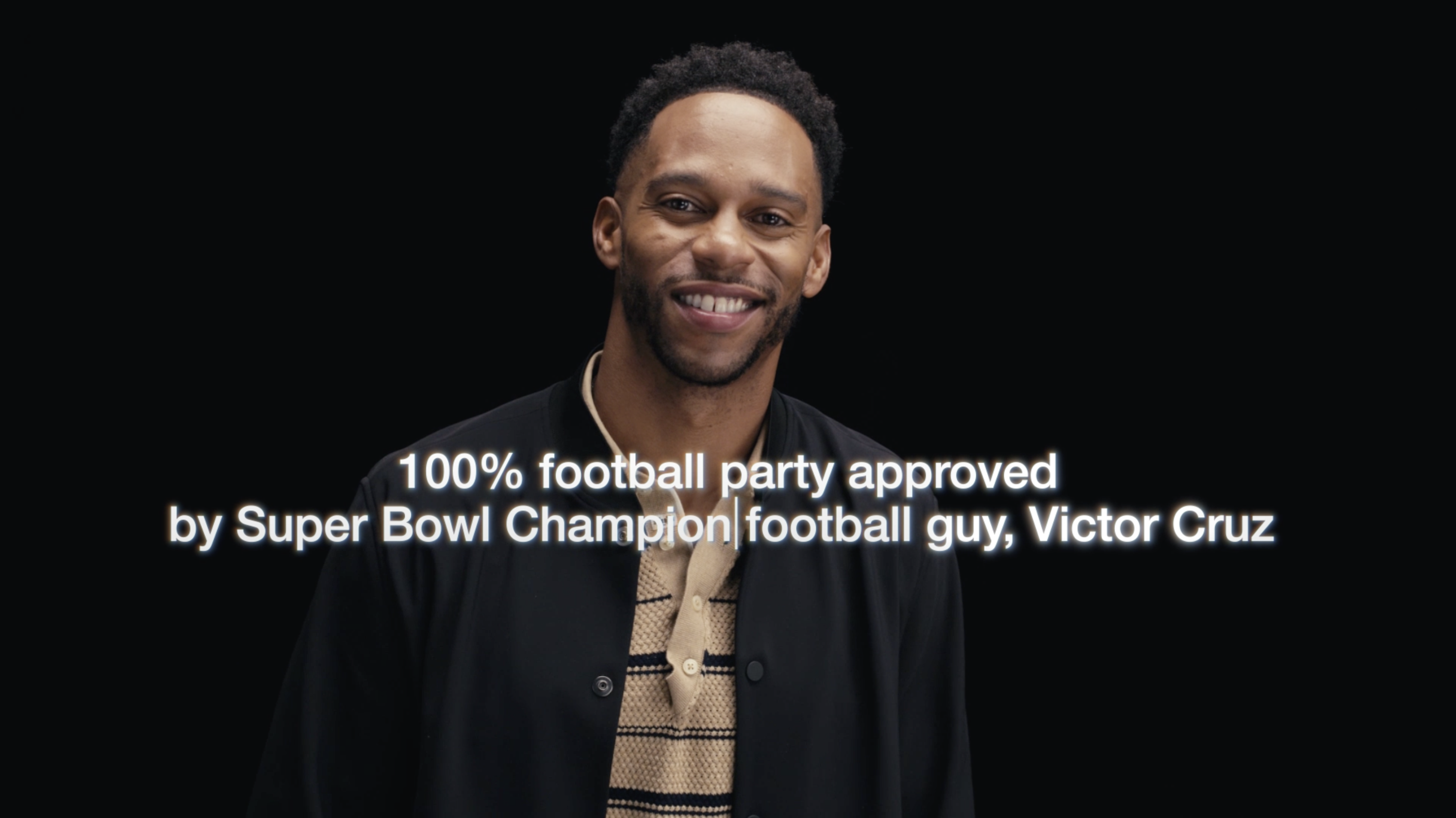 Victor Cruz smiling with text that reads, &quot;100% football party approved by Super Bowl Champion football guy, Victor Cruz&quot;