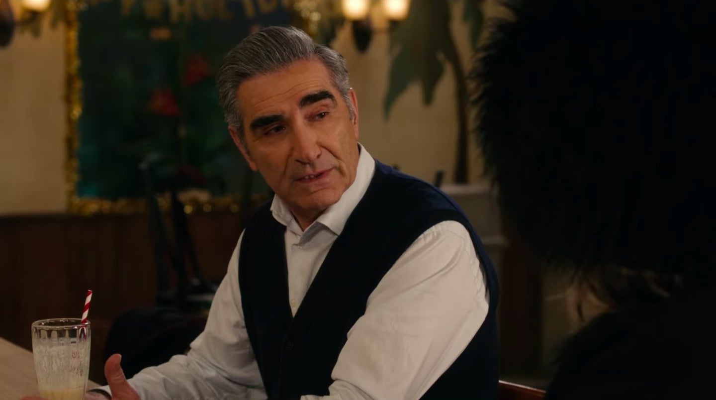 Johnny sitting at the cafe counter with a milkshake sitting in front of him in &quot;Schitt&#x27;s Creek&quot;