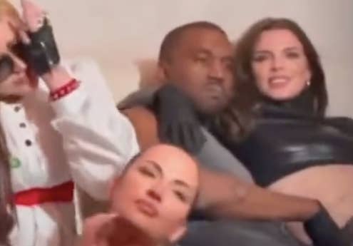 Julia Fox sitting on Kanye West&#x27;s lap in a candid photo