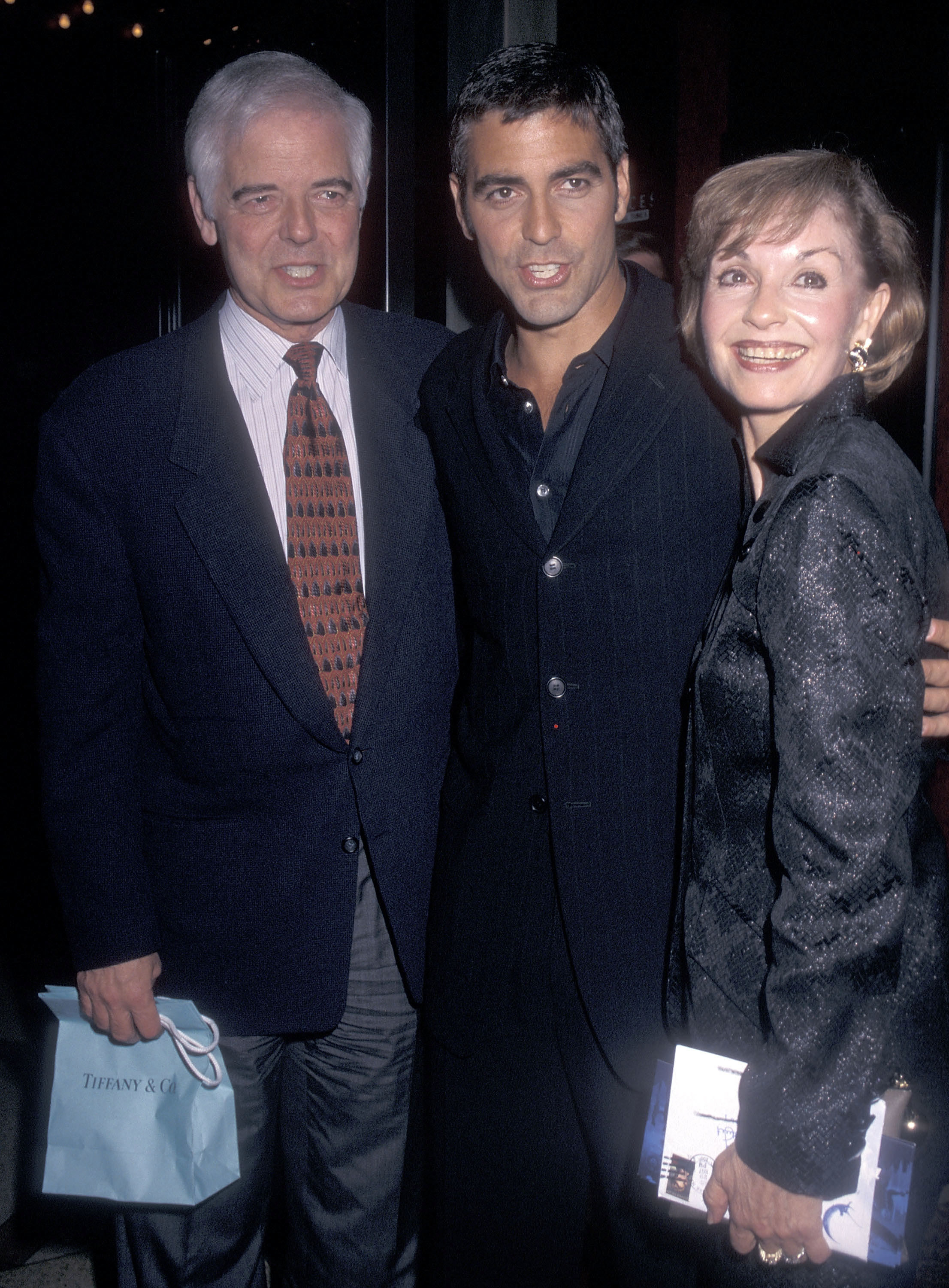 Nick Clooney, George Clooney, and Nina Warren at a premiere