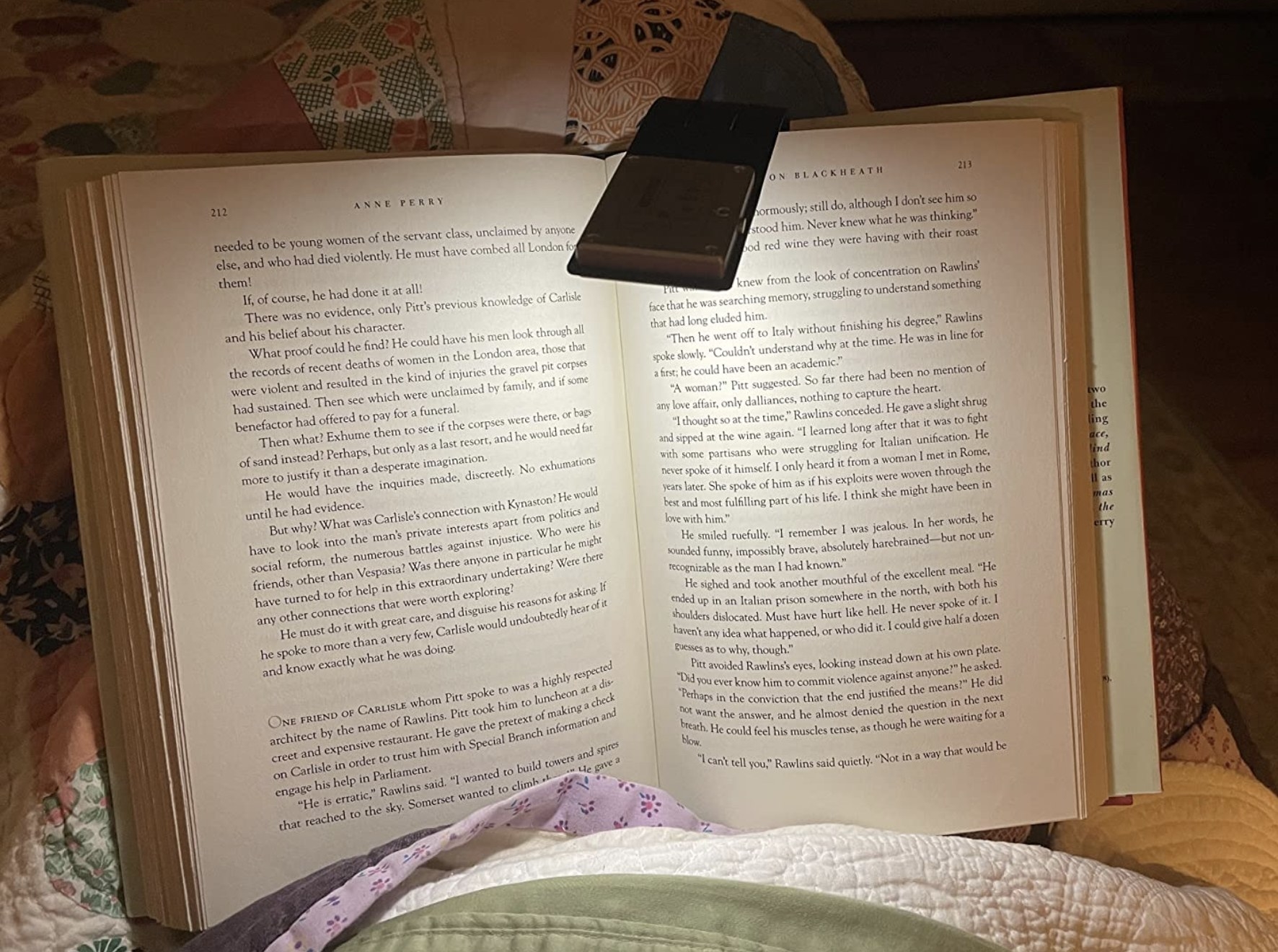 a reviewer&#x27;s book illuminated by the book light