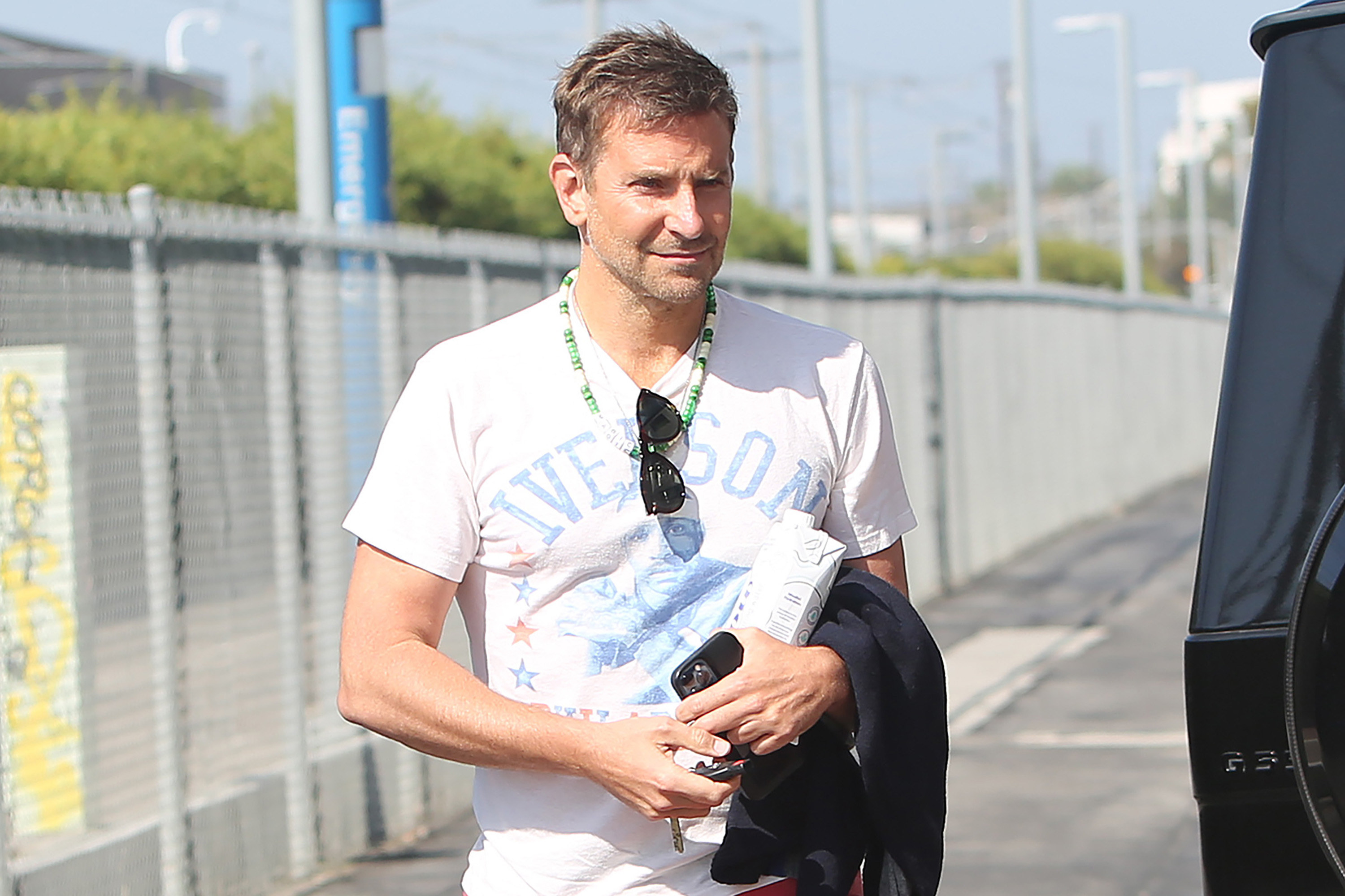 Cooper holds his stuff while waiting outside