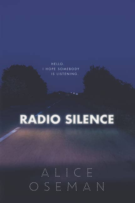 Headlights shining on a dark road as the book cover with the text &quot;Hello, I Hope Somebody is Listening&quot;. Book called Radio Silence by Alice Oseman