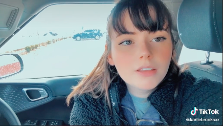 Karlie sitting in her car talking about the porn industry