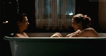 Kate Winslet splashing David Kross in the bathtub