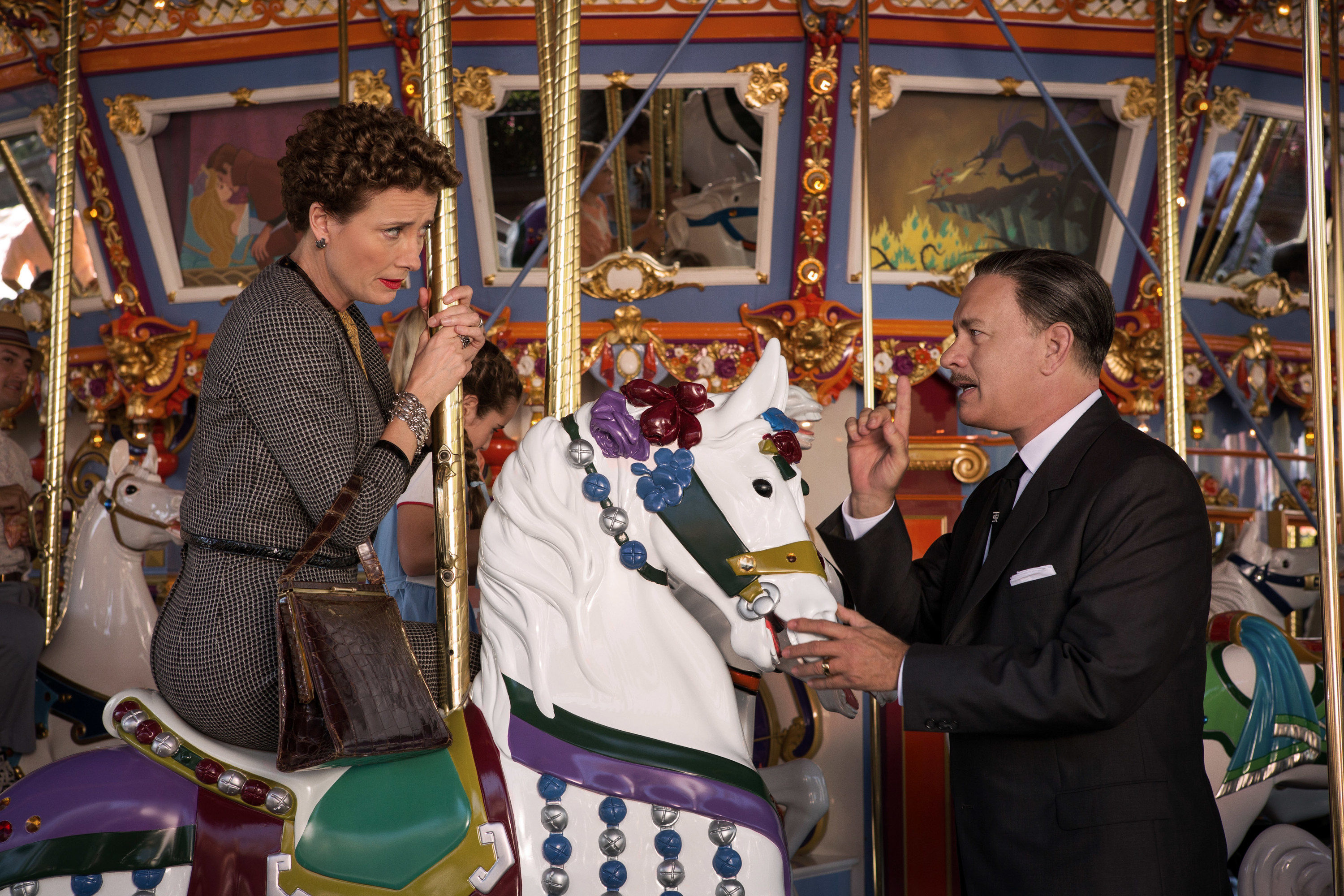 Emma Thompson and Tom Hanks on the Disneyland merry-go-round in Saving Mr. Banks