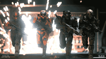 Four Spartan soldiers running with guns in unison with explosions behind them in  &quot;Halo: Infinite&quot;