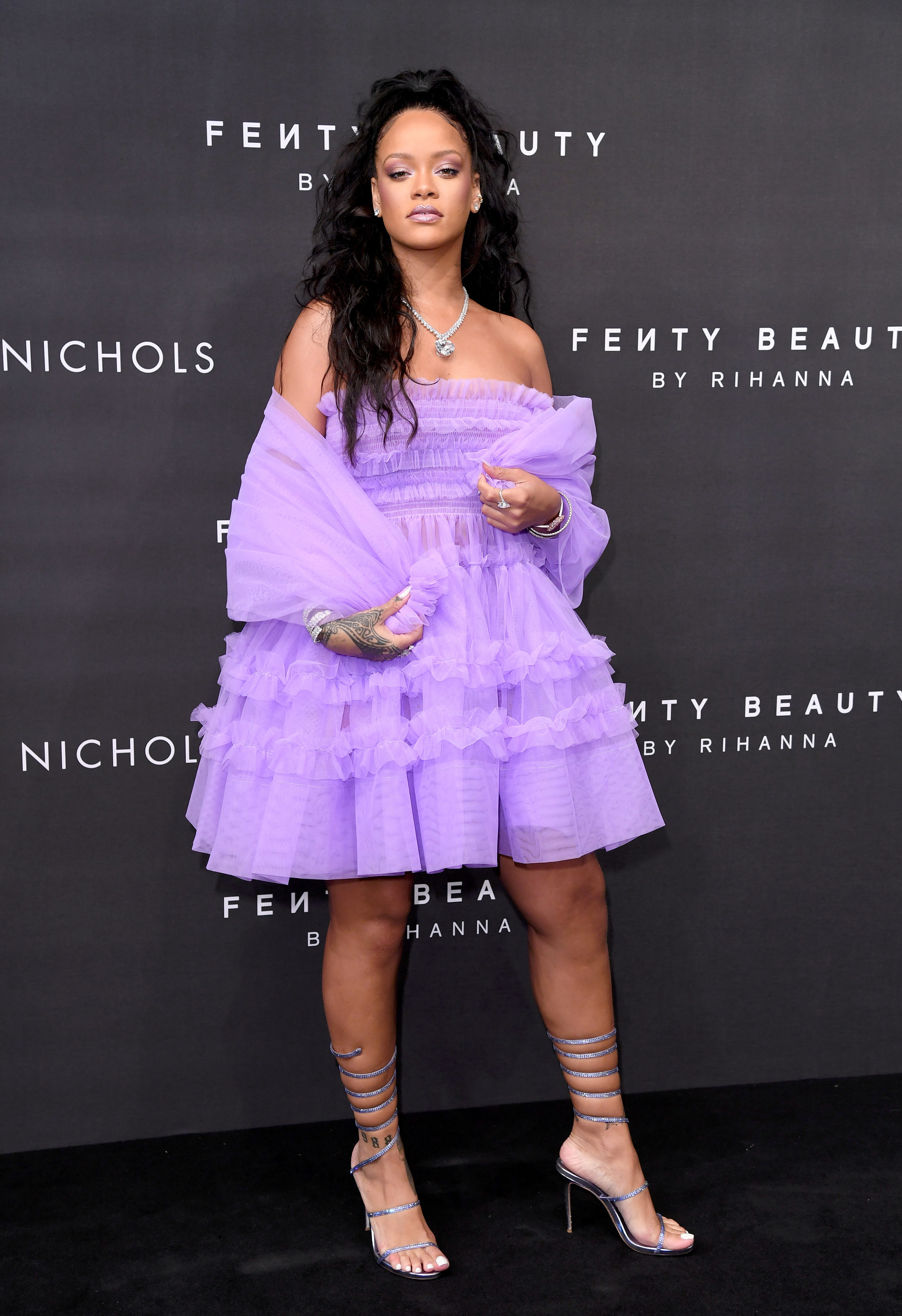 Rihanna posing for her Fenty Beauty launch party in London