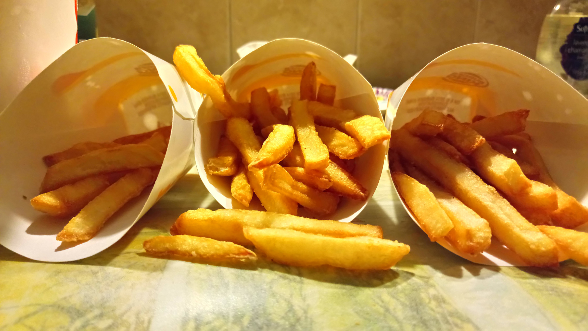 three containers of burger king fries