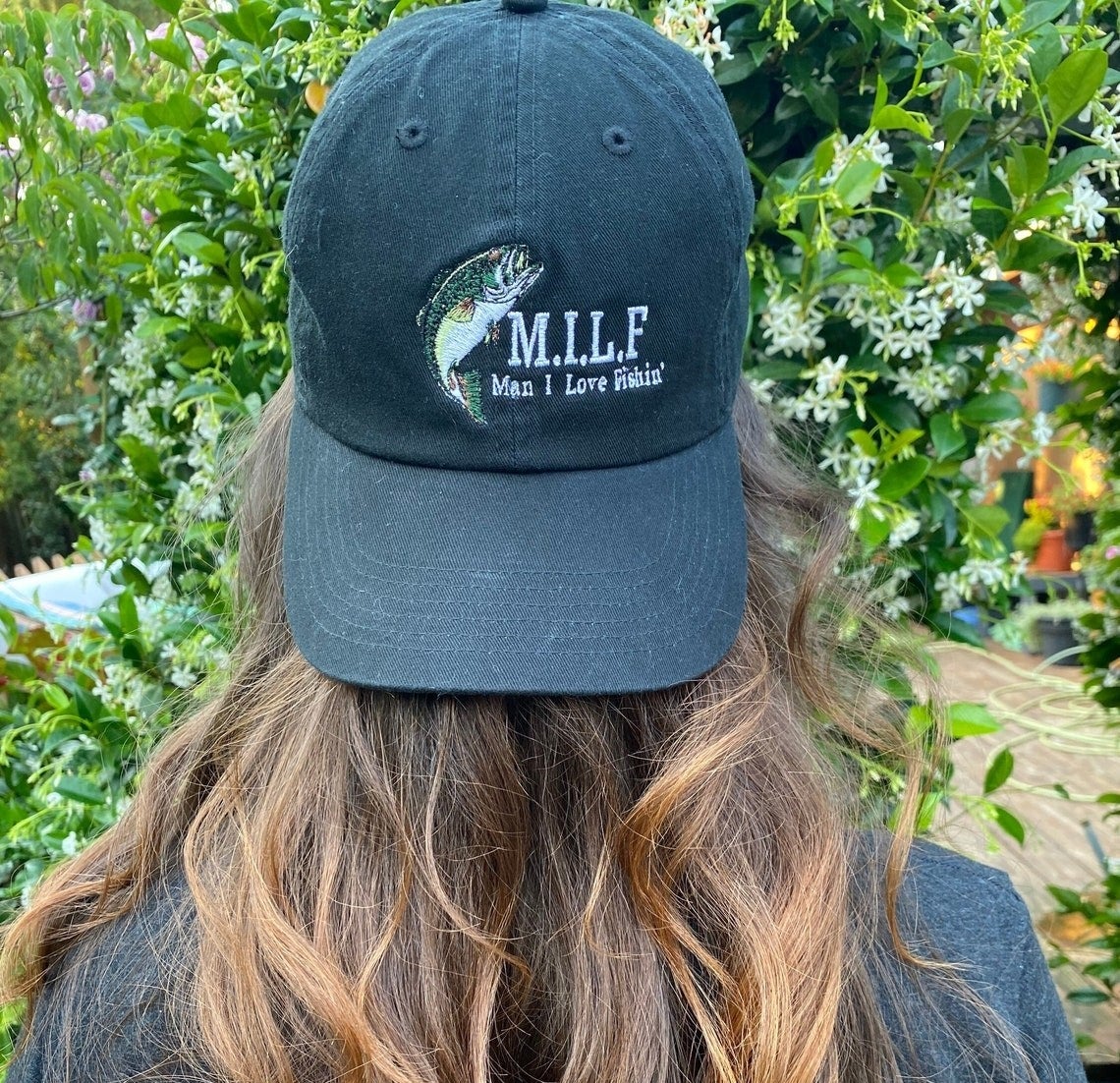 model wears hat that says MILF man i love to fish