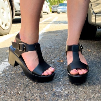 Reviewer wearing black platform sandals