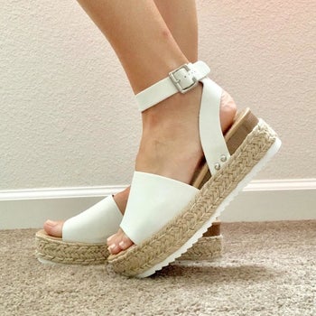 Reviewer wearing white platform sandals