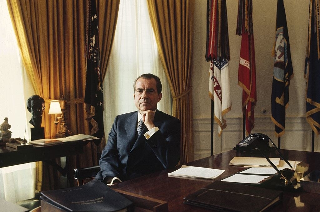Nixon sitting in the Oval Office at the White House