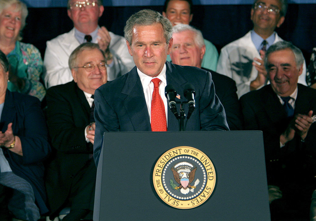 Bush speaking at a podium