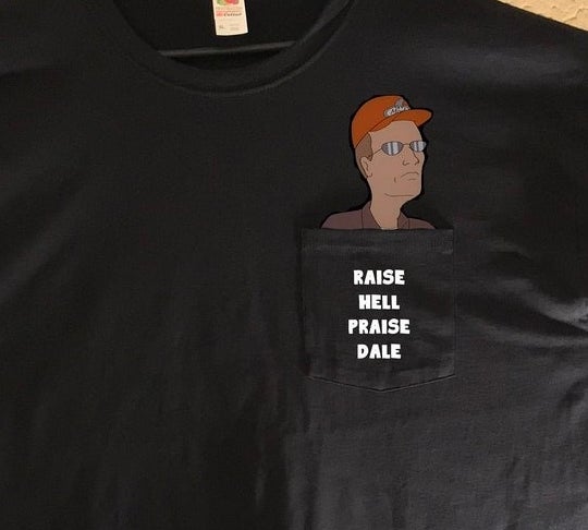 pocket tee with dale gribble coming out of the pocket that says raise hell praise dale