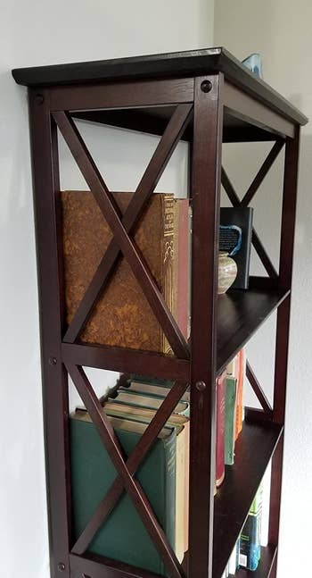 a reviewer photo of the criss-cross detail on the side of the brown bookshelf