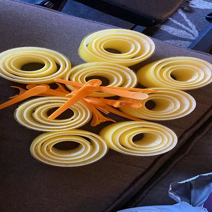 reviewer photo of the yellow velcro rollers and clips