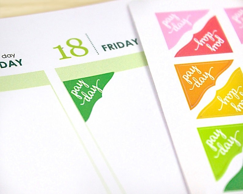 the colorful stickers that read &quot;pay day&quot; and fit into the corner of calendar squares