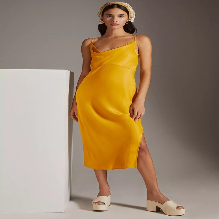 model wearing the yellow slip dress