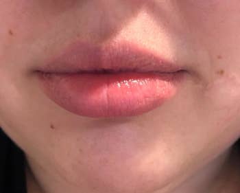 Close-up of reviewer wearing product on lips