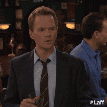 BArney from HIMYM raises his hand in a bar