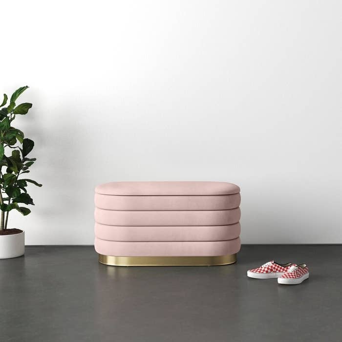 The upholstered retention seat successful blush pink