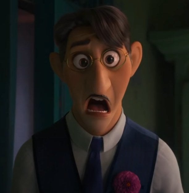 Agustin Madrigal looking shocked at something Mirabel is showing him