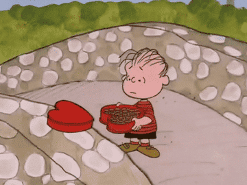 Linus throws chocolates from a heart box over a bridge in &quot;Be My Valentine, Charlie Brown&quot;