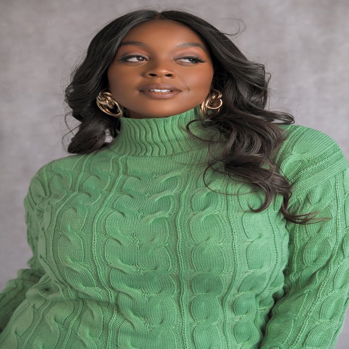 a model in the green knit dress