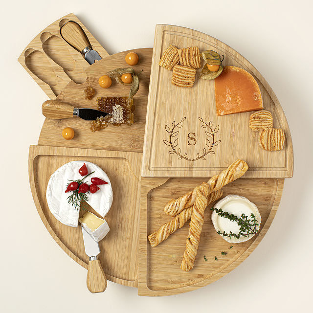personalized swivel cheese board adorned with food