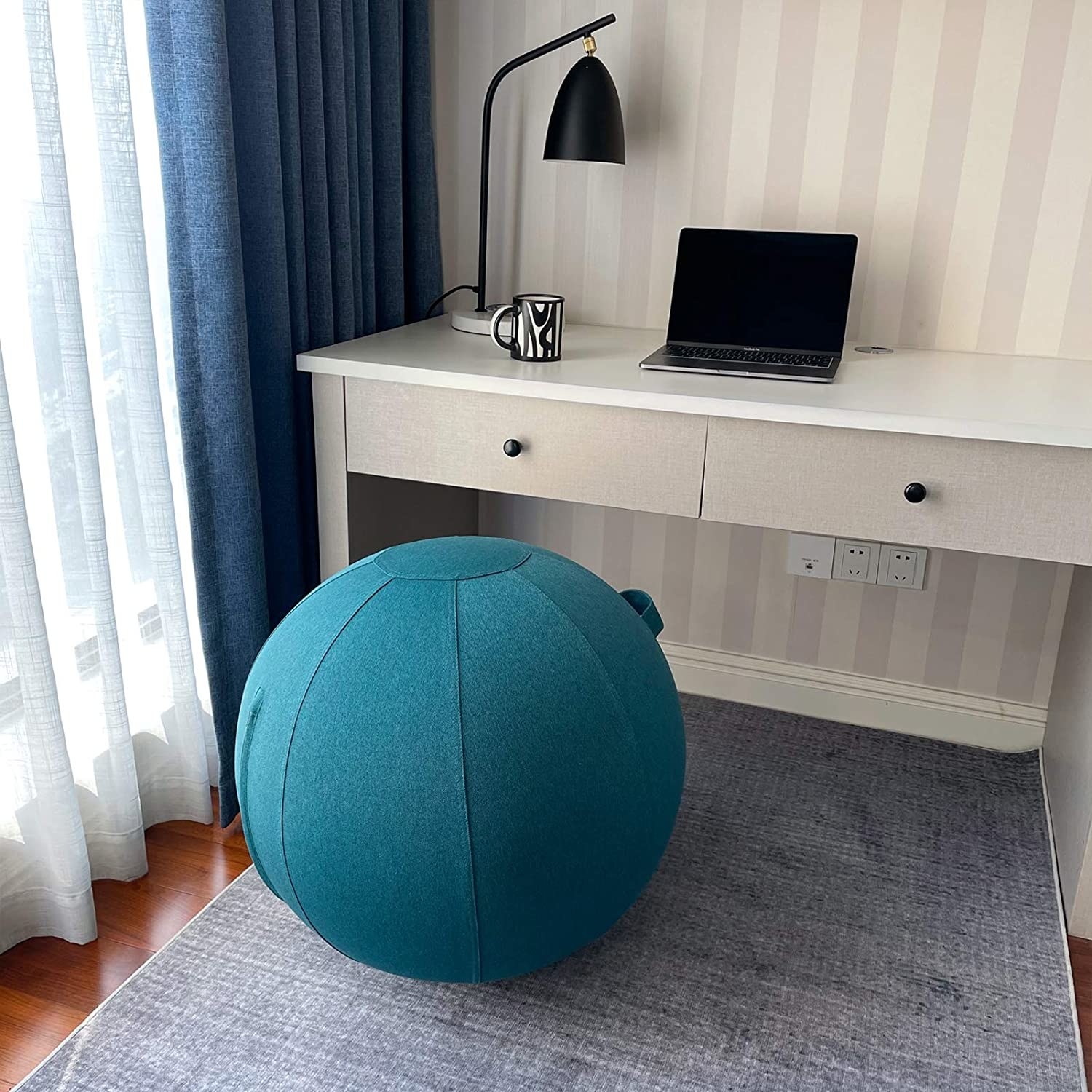 The yoga ball in front of a desk