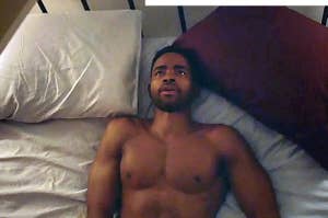 Lawrence from insecure shirtless in bed