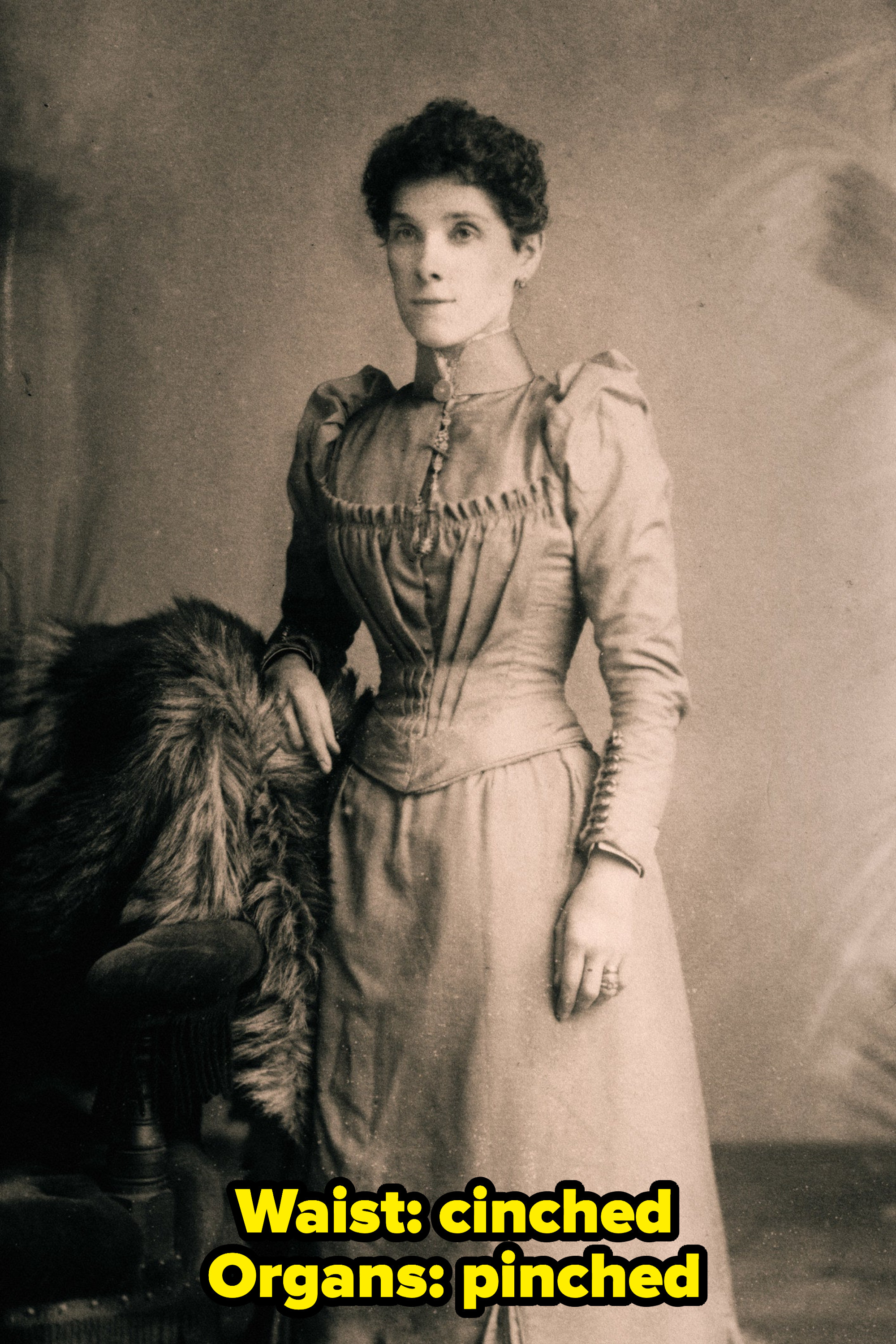 A victorian lady wearing a corset with caption: Waist: cinched, organs: pinched