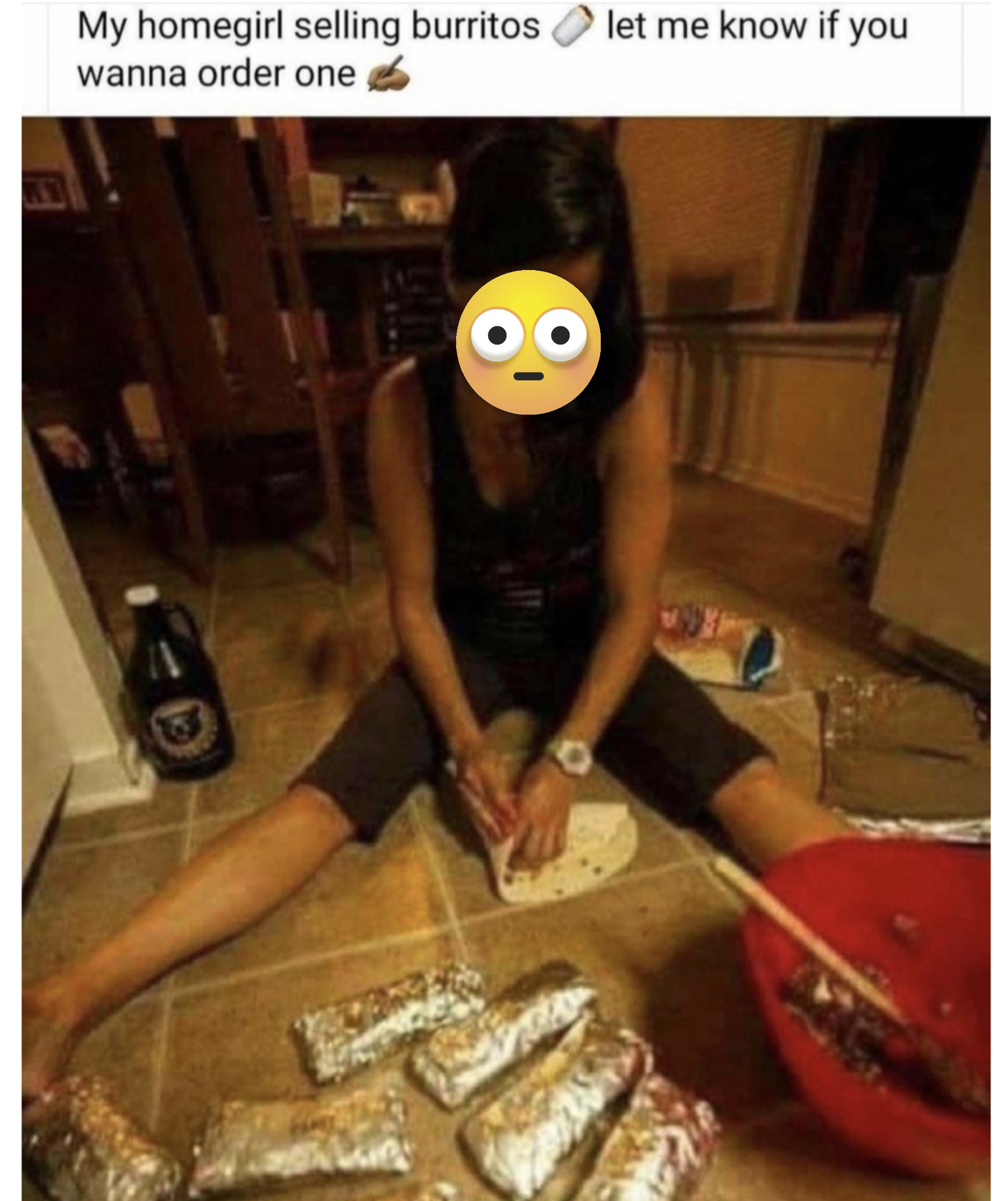 Person sitting on tiled floor wrapping a tortilla