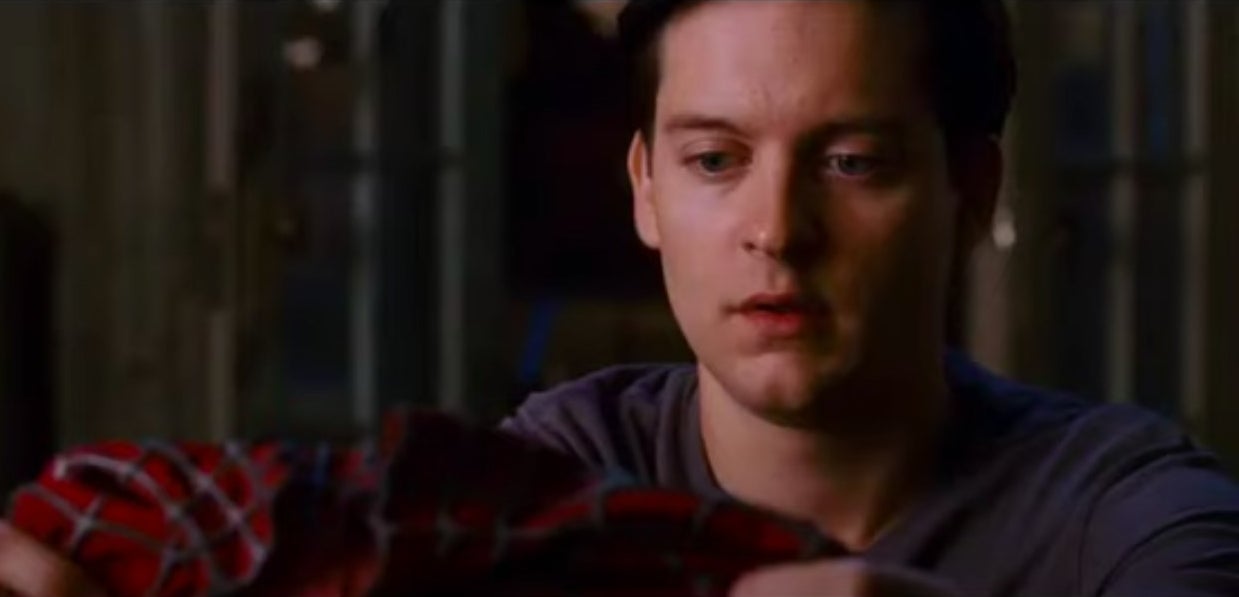 Peter holding his Spider-Man suit in his apartment in &quot;Spider-Man 3&quot;