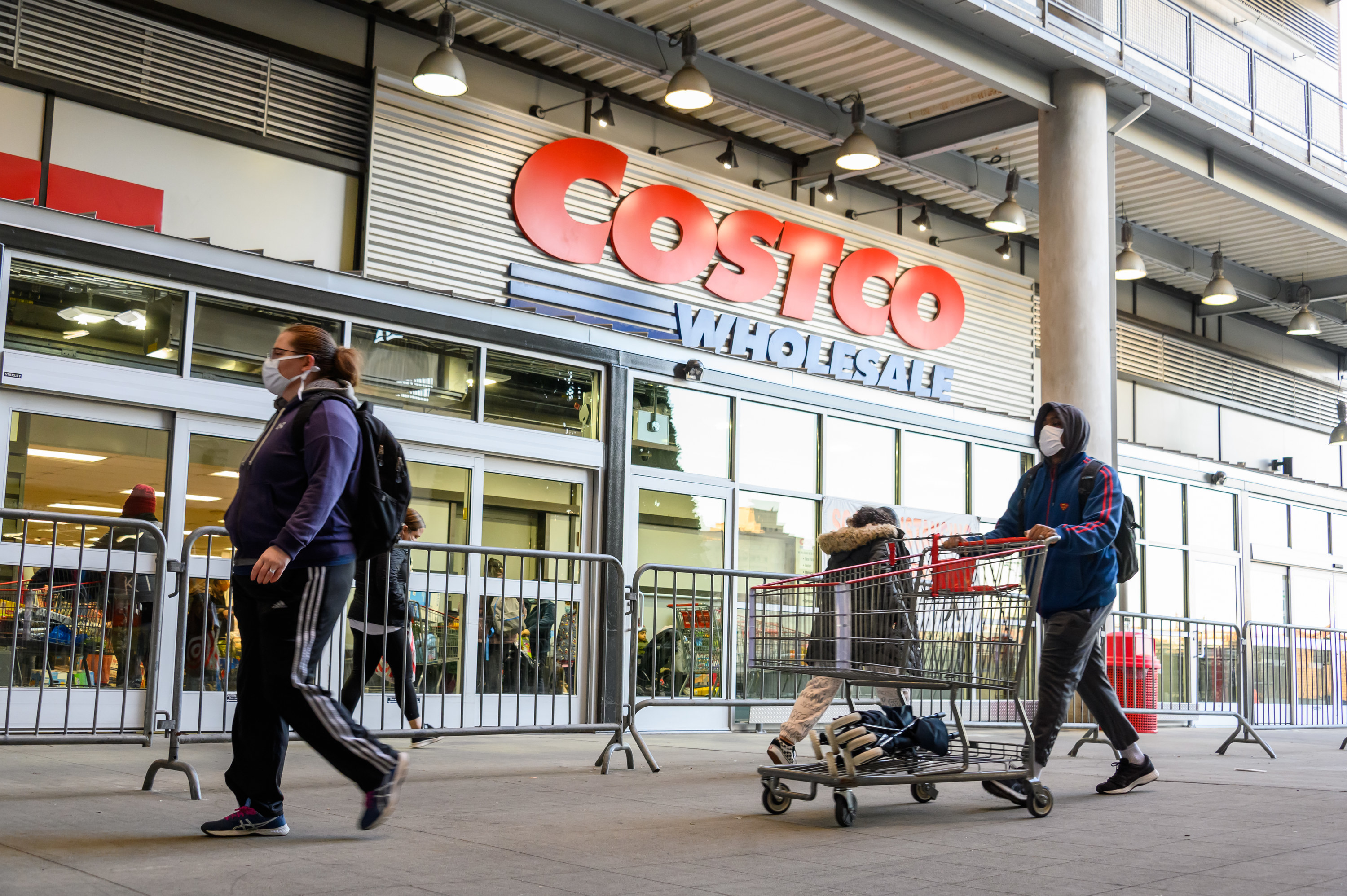People wearing masks going to a Costco store