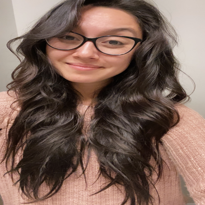 a reviewer photo of their long hair after using the cream