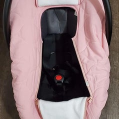 The car seat cover on a car seat with the front flap open